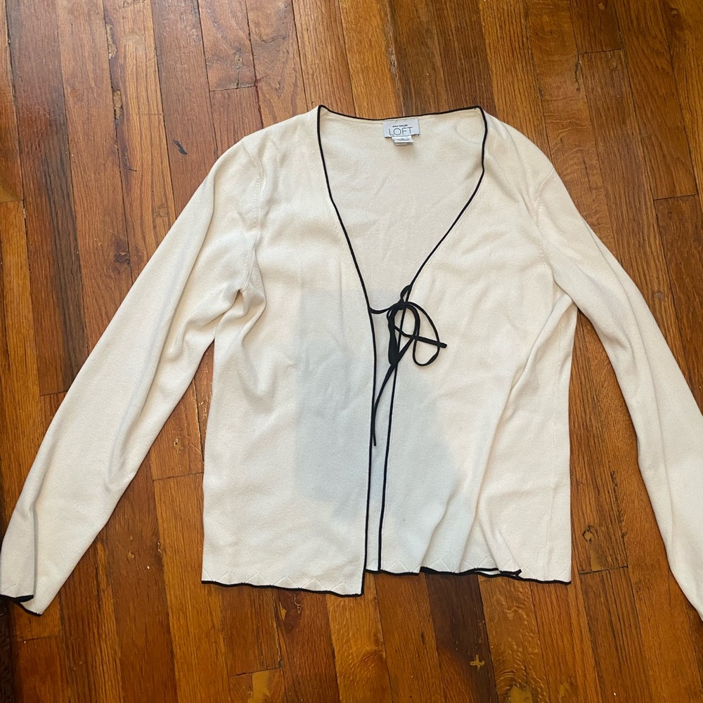 The Loft long sleeved cream colored tie top with black trim